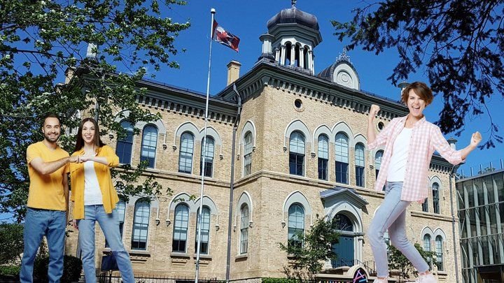 A young couple sharing a fist bump and a short-haired woman in a plaid shirt celebrating in front of a Brampton backdrop